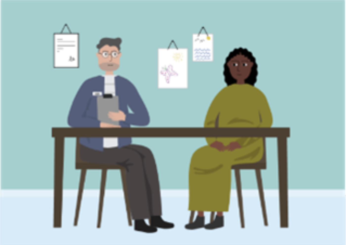 A woman who has suffered violence talking to a psychologist in an office.
